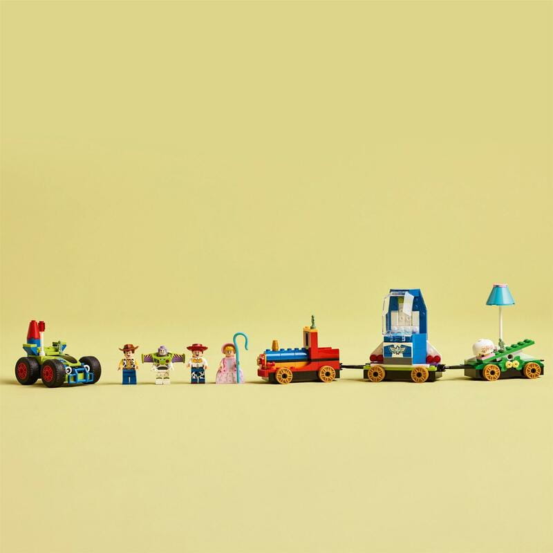 Конструктор LEGO Disney Pixar Святкування з Історії Іграшок: потяг і авто для перегонів (43264)